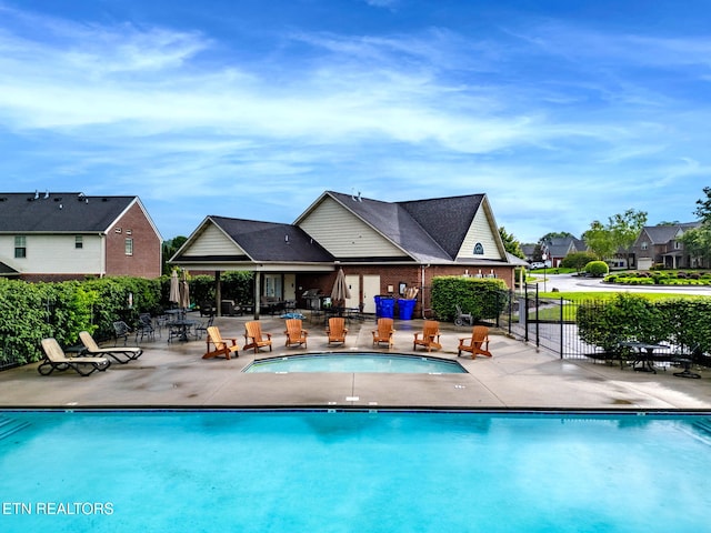 12888 Lily Pond Ln, Knoxville, TN 37922 - community pool with fence, a patio, and a residential view