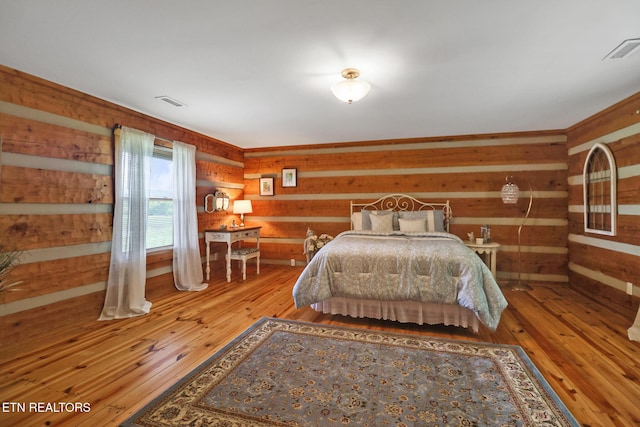871 Poplar Creek Rd, Oliver Springs, TN 37840 - bedroom featuring wood walls and hardwood / wood-style flooring
