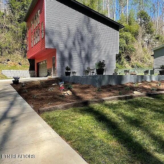 667 Turkey Nest Rd, Gatlinburg, TN 37738 - view of home's exterior featuring a garage and concrete driveway
