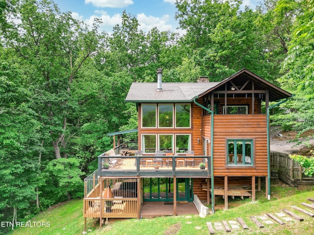 529 Deer Path Ln, Gatlinburg, TN 37738 - rear view of house with a wooden deck, a chimney, log veneer siding, and a shingled roof