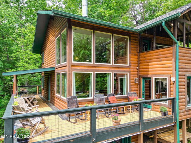 529 Deer Path Ln, Gatlinburg, TN 37738 - back of property with faux log siding and a deck