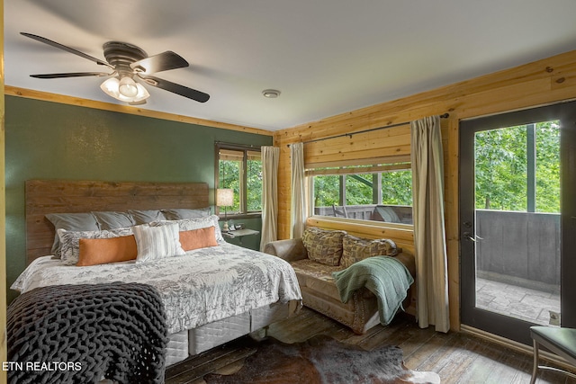529 Deer Path Ln, Gatlinburg, TN 37738 - bedroom with hardwood / wood-style floors, ceiling fan, and wooden walls