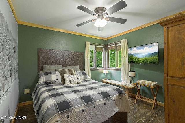 529 Deer Path Ln, Gatlinburg, TN 37738 - bedroom featuring wood finished floors, a textured wall, baseboards, and a ceiling fan