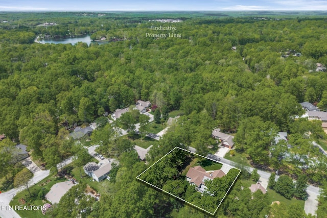 157 Garfield Ct, Crossville, TN 38558 - aerial view of residential area featuring a forest, property parcel outlined, and a nearby body of water