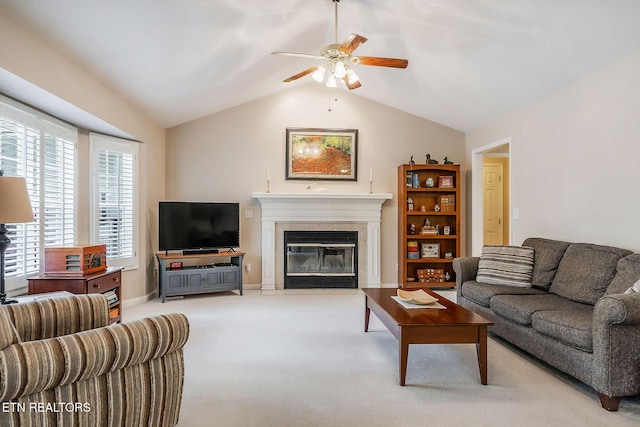 157 Garfield Ct, Crossville, TN 38558 - living room featuring a ceiling fan, a fireplace with flush hearth, light colored carpet, vaulted ceiling, and baseboards