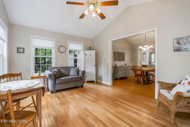 157 Garfield Ct, Crossville, TN 38558 - living area with light wood-style floors, lofted ceiling, a ceiling fan, a chandelier, and baseboards