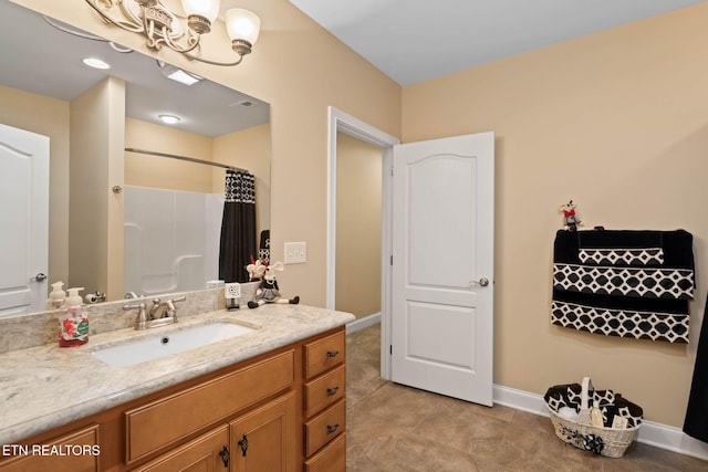 115 Tecumseh Ln, Loudon, TN 37774 - bathroom with vanity, a shower with curtain, baseboards, and a chandelier