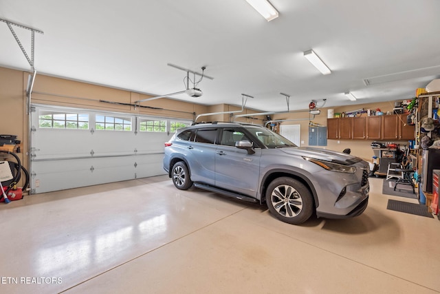 115 Tecumseh Ln, Loudon, TN 37774 - garage featuring a garage door opener and electric panel