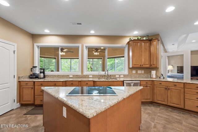 115 Tecumseh Ln, Loudon, TN 37774 - kitchen featuring a sink, black electric stovetop, light stone counters, a kitchen island, and recessed lighting