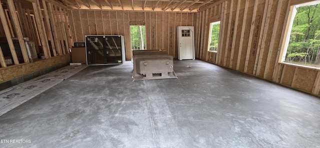 1640 E Overlook Rd, Monterey, TN 38574 - unfurnished living room featuring healthy amount of natural light and unfinished concrete flooring
