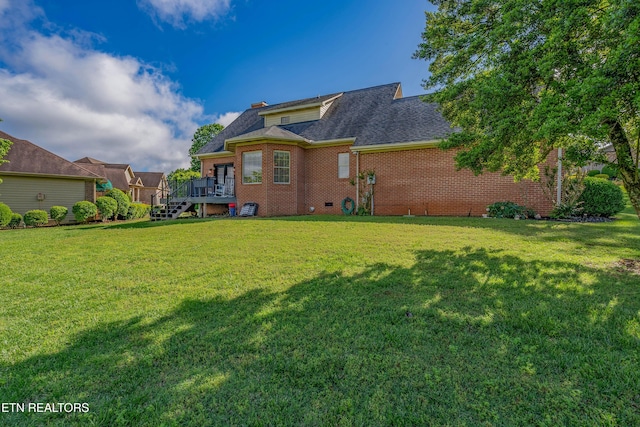 312 Cheestana Way, Loudon, TN 37774 - rear view of house featuring a deck, a yard, brick siding, and roof with shingles