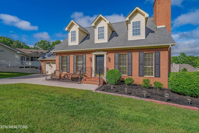 312 Cheestana Way, Loudon, TN 37774 - cape cod house with brick siding, a front lawn, an attached garage, and a chimney