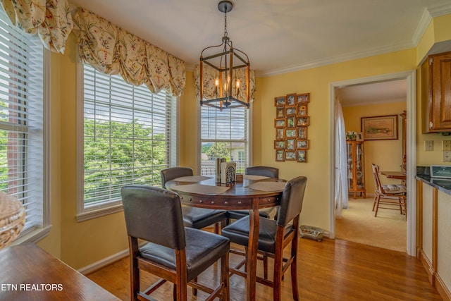 312 Cheestana Way, Loudon, TN 37774 - dining area featuring a chandelier, crown molding, light wood-style flooring, and baseboards