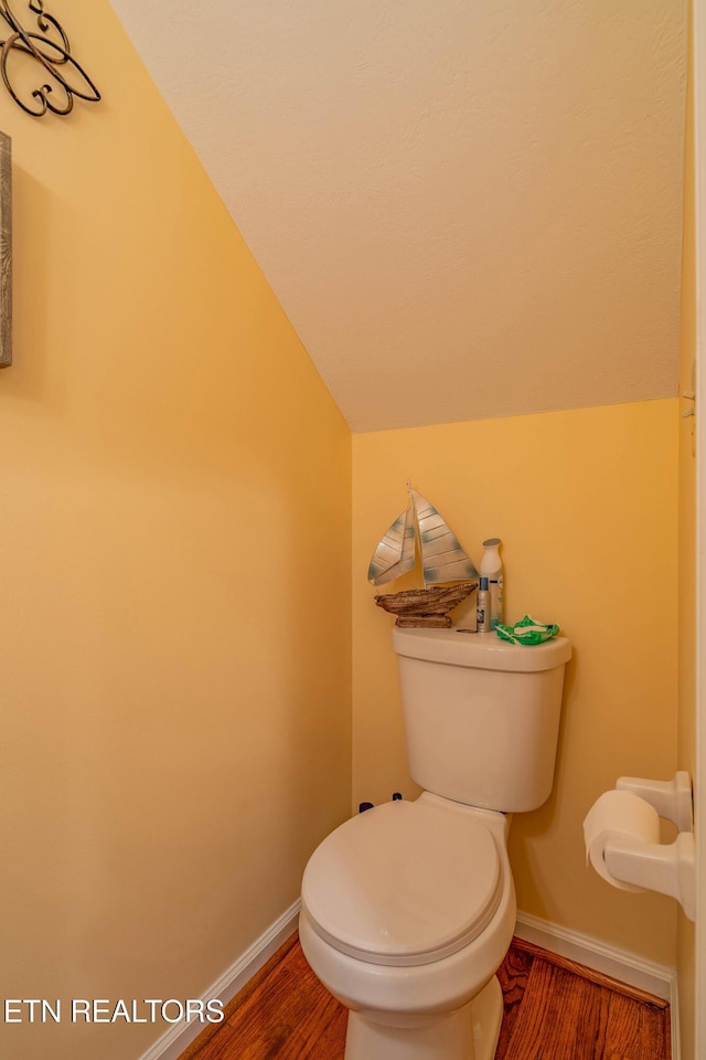 312 Cheestana Way, Loudon, TN 37774 - bathroom featuring vaulted ceiling, baseboards, wood finished floors, and toilet