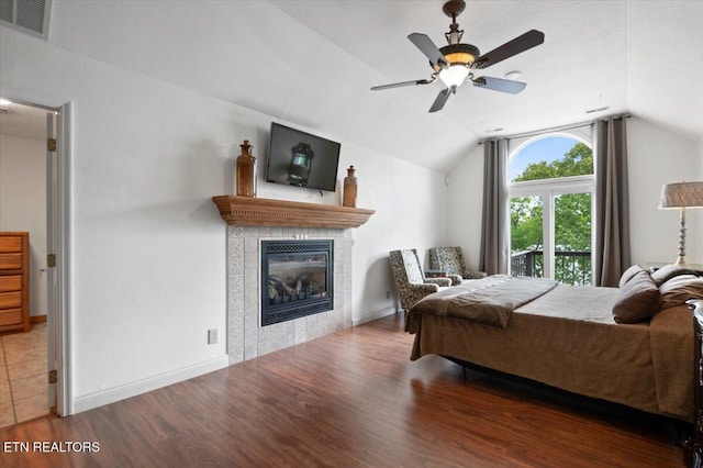 700 Shanghai Landing Ln Unit 11, Lafollette, TN 37766 - bedroom featuring wood finished floors, vaulted ceiling, a tiled fireplace, ceiling fan, and baseboards