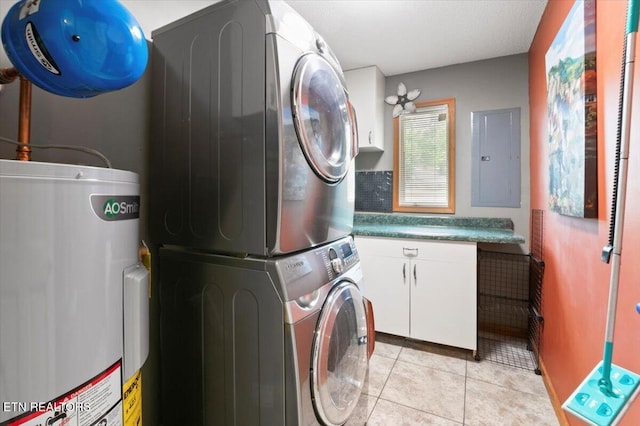 700 Shanghai Landing Ln Unit 11, Lafollette, TN 37766 - washroom with stacked washer / dryer, cabinet space, water heater, electric panel, and light tile patterned floors