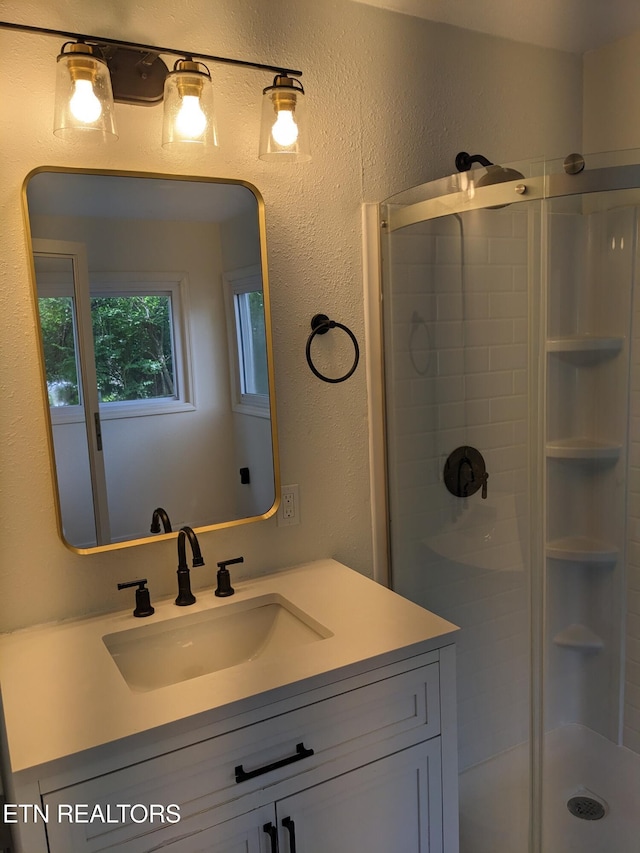 628 Algonquin Dr, Morristown, TN 37813 - full bath featuring a shower stall, vanity, and a textured wall