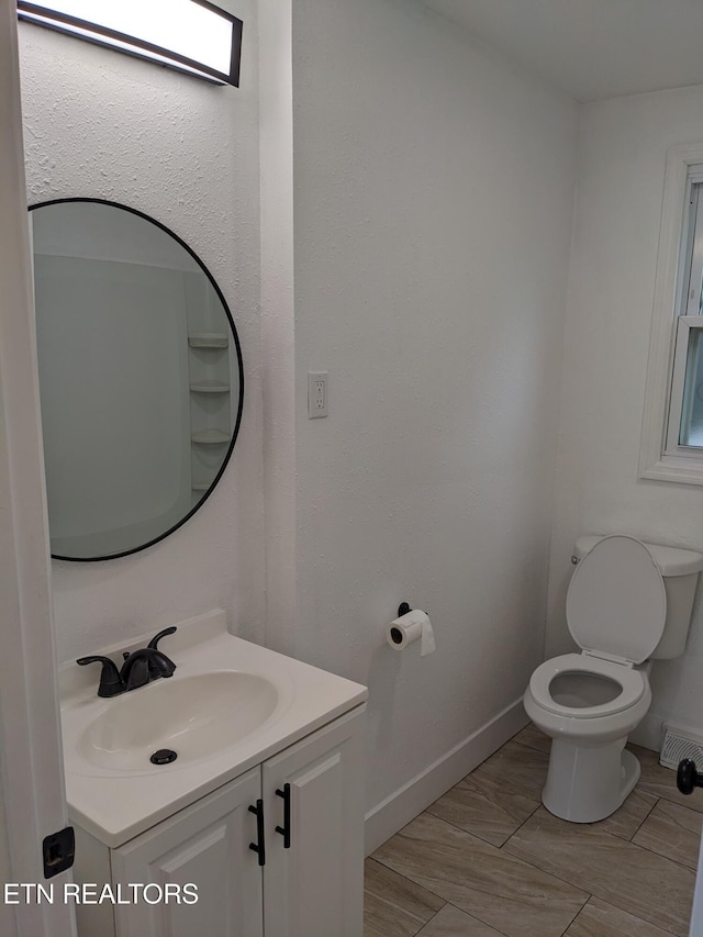 628 Algonquin Dr, Morristown, TN 37813 - bathroom featuring vanity, toilet, and baseboards