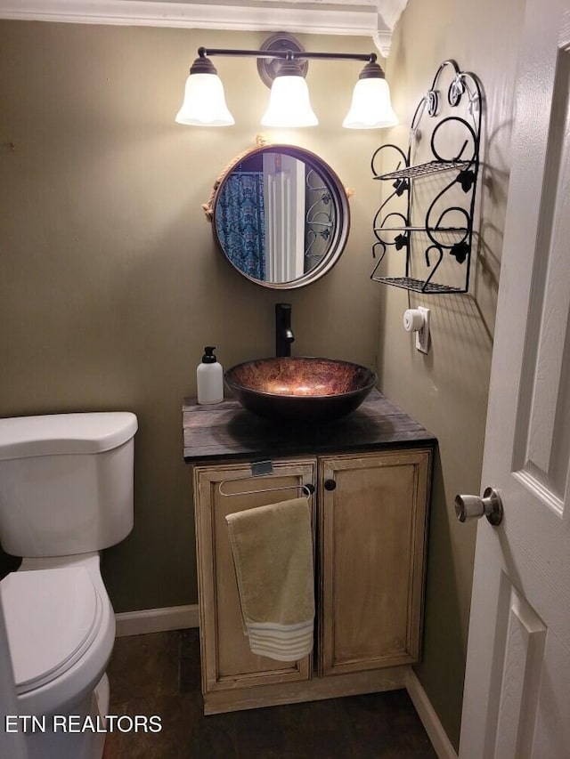 103 Renner Ln, Oliver Springs, TN 37840 - half bathroom with toilet, vanity, baseboards, and crown molding