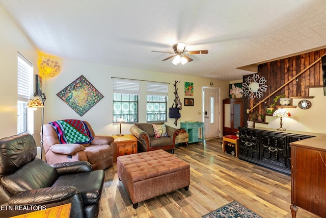 103 Renner Ln, Oliver Springs, TN 37840 - living area with stairway, ceiling fan, wood finished floors, and a textured ceiling