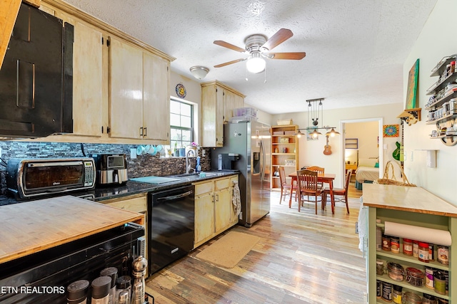 103 Renner Ln, Oliver Springs, TN 37840 - kitchen with black dishwasher, stainless steel refrigerator with ice dispenser, a textured ceiling, light wood-type flooring, and ceiling fan