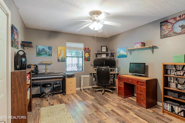 103 Renner Ln, Oliver Springs, TN 37840 - office featuring radiator, wood finished floors, ceiling fan, a textured ceiling, and baseboards