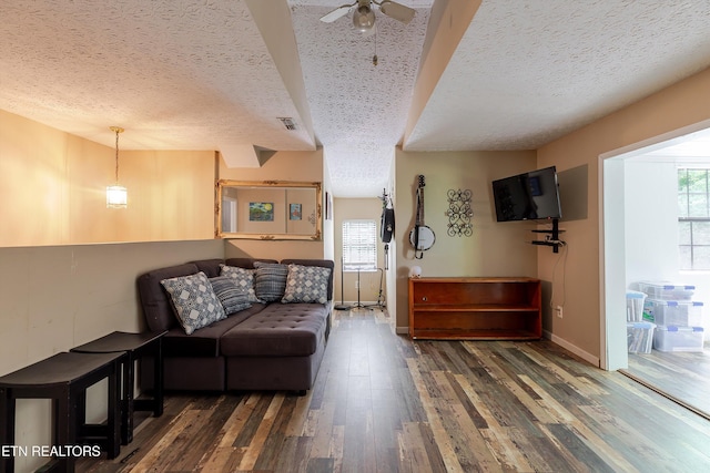 103 Renner Ln, Oliver Springs, TN 37840 - living room featuring a textured ceiling, healthy amount of natural light, wood finished floors, ceiling fan, and baseboards