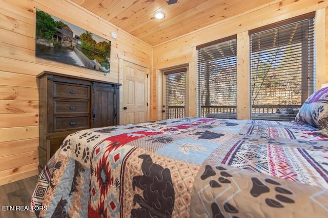 bedroom with wooden walls, access to outside, wood ceiling, wood finished floors, and recessed lighting