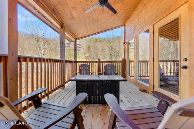 wooden deck featuring a ceiling fan