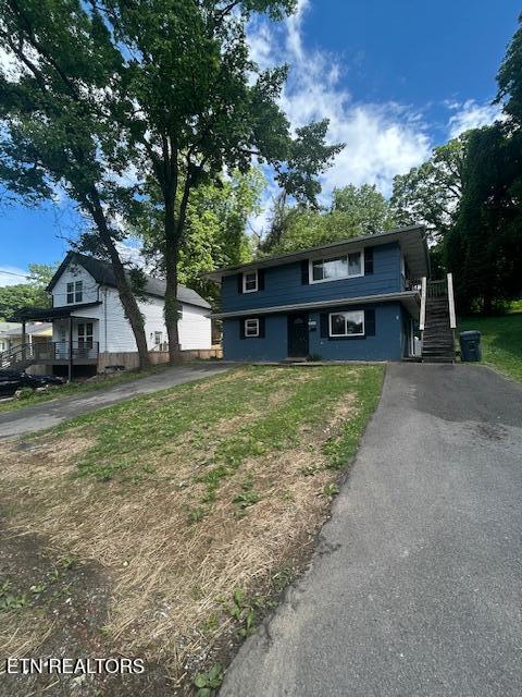 3614 Selma Ave, Knoxville, TN 37914 - view of front of home with asphalt driveway, stairs, and a front lawn