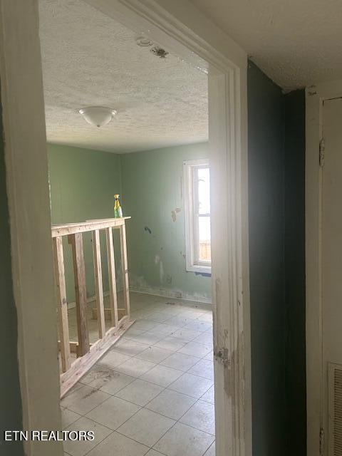 3614 Selma Ave, Knoxville, TN 37914 - hall with a textured ceiling and light tile patterned floors