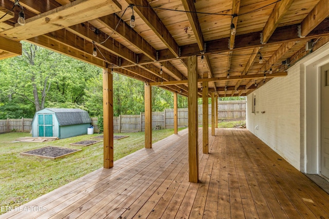 4525 Fawnie Ln, Knoxville, TN 37918 - wooden terrace featuring a storage shed and an outbuilding