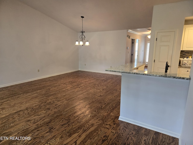 678 Applegate Ln Unit 33, Knoxville, TN 37934 - spare room with dark wood-style flooring, baseboards, a chandelier, and a sink