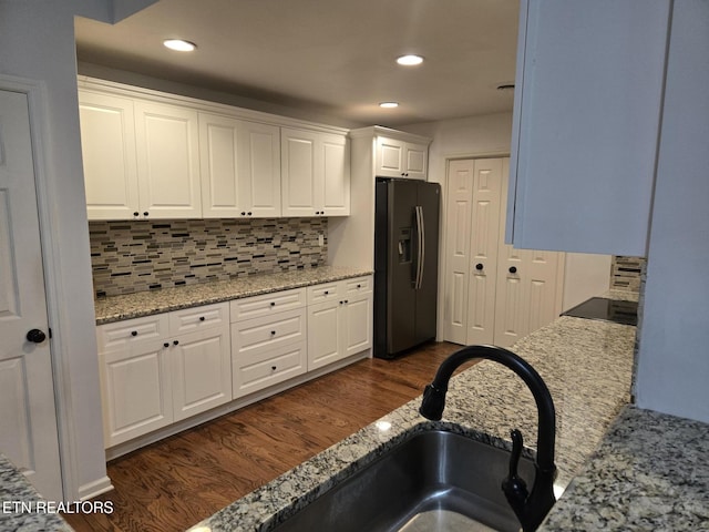 678 Applegate Ln Unit 33, Knoxville, TN 37934 - kitchen with black fridge, a sink, tasteful backsplash, white cabinets, and recessed lighting