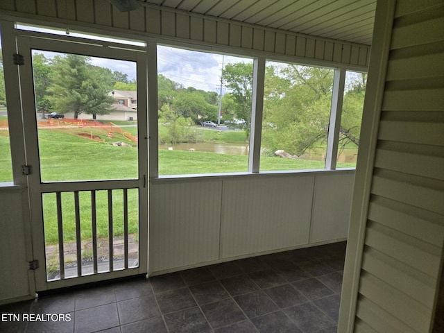 678 Applegate Ln Unit 33, Knoxville, TN 37934 - unfurnished sunroom featuring a water view, plenty of natural light, and view of scattered trees
