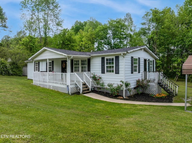 122 Mill Rd, Wartburg, TN 37887 - view of front facade with a porch, a front yard, crawl space, and roof with shingles