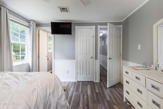 122 Mill Rd, Wartburg, TN 37887 - bedroom with dark wood finished floors, a wainscoted wall, ornamental molding, and a closet