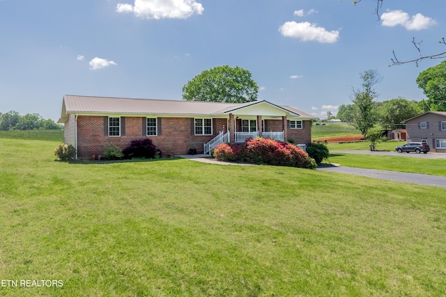 917 Swan Pond Circle Rd, Harriman, TN 37748 - ranch-style home with brick siding, covered porch, and a front yard