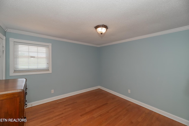 917 Swan Pond Circle Rd, Harriman, TN 37748 - empty room with wood finished floors, crown molding, a textured ceiling, and baseboards