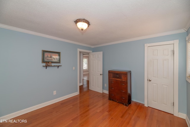 917 Swan Pond Circle Rd, Harriman, TN 37748 - bedroom featuring crown molding, wood finished floors, baseboards, and a textured ceiling