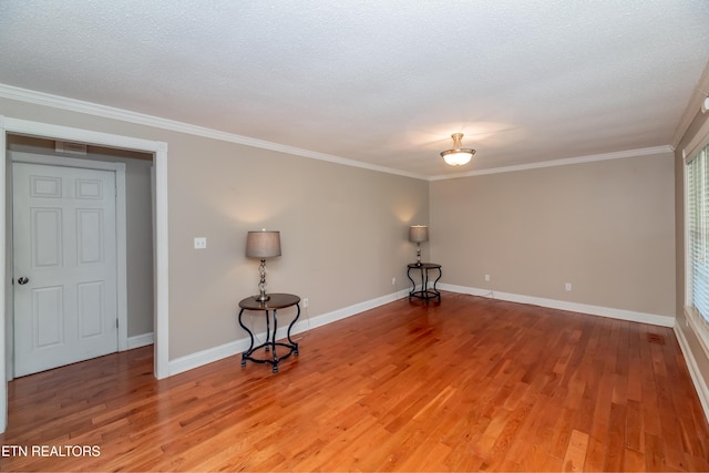 917 Swan Pond Circle Rd, Harriman, TN 37748 - empty room with light wood finished floors, ornamental molding, baseboards, and a textured ceiling