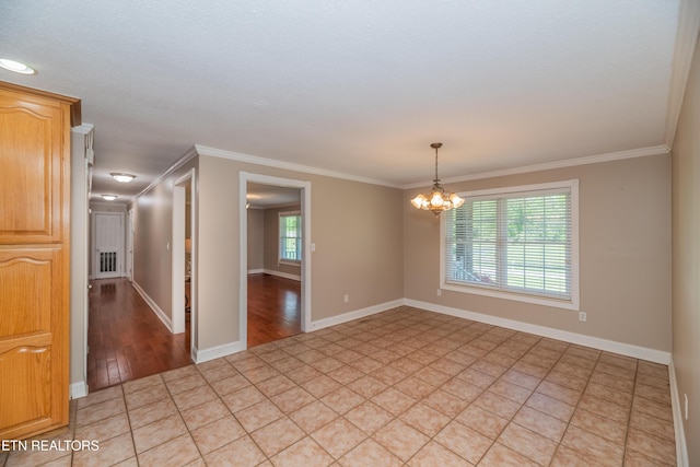 917 Swan Pond Circle Rd, Harriman, TN 37748 - empty room featuring a chandelier, ornamental molding, baseboards, and light wood-style floors