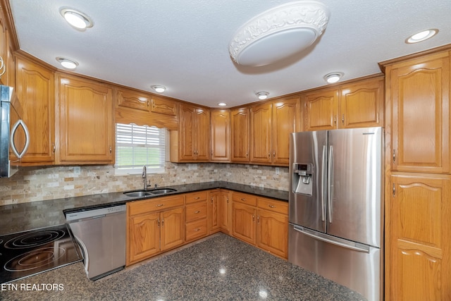 917 Swan Pond Circle Rd, Harriman, TN 37748 - kitchen with appliances with stainless steel finishes, a sink, brown cabinets, dark stone counters, and decorative backsplash