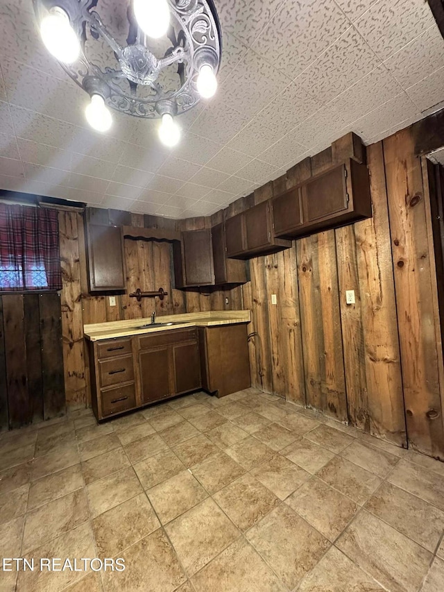 917 Swan Pond Circle Rd, Harriman, TN 37748 - kitchen with wooden walls, light countertops, and dark brown cabinetry