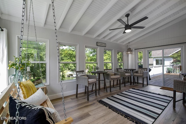 sunroom / solarium with a wooden deck and wood finished floors