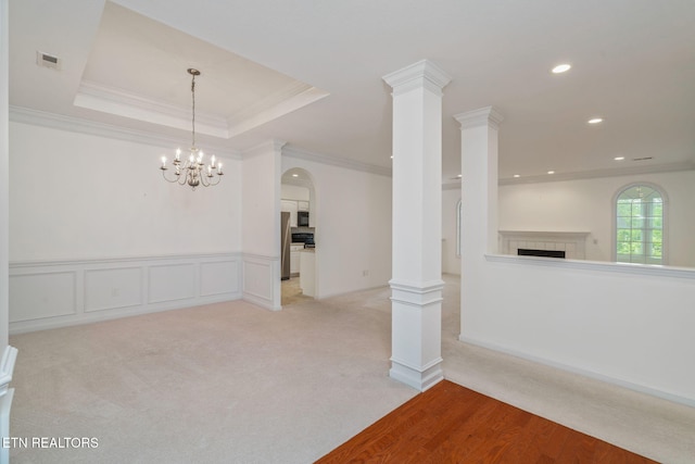 111 Devanshire Ct, Oak Ridge, TN 37830 - unfurnished living room with a fireplace, arched walkways, recessed lighting, ornamental molding, and light carpet