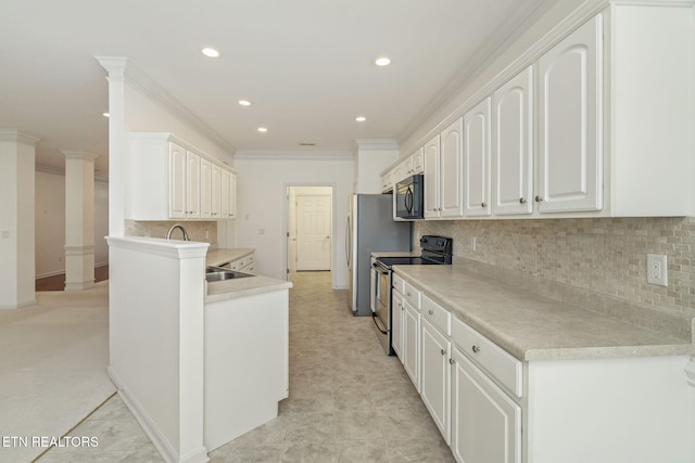 111 Devanshire Ct, Oak Ridge, TN 37830 - kitchen with stainless steel electric stove, black microwave, ornamental molding, white cabinetry, and backsplash