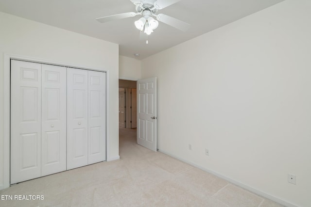 111 Devanshire Ct, Oak Ridge, TN 37830 - unfurnished bedroom with light colored carpet, a closet, baseboards, and a ceiling fan