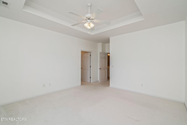111 Devanshire Ct, Oak Ridge, TN 37830 - empty room with a raised ceiling, light carpet, crown molding, ceiling fan, and baseboards