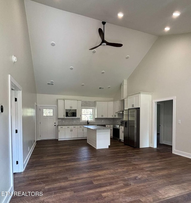 136 Log Ln, Jacksboro, TN 37757 - kitchen featuring high vaulted ceiling, appliances with stainless steel finishes, ceiling fan, white cabinets, and a kitchen island